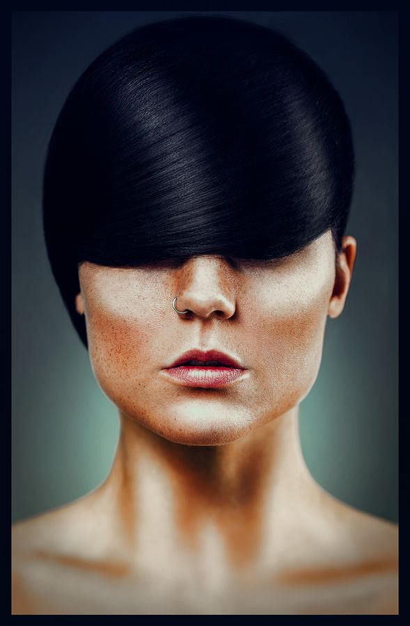 A sculpted black fringe covering the eyes, freckles and a nose ring below